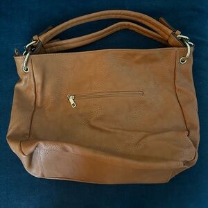 Light brown synthetic leather purse in great condition.